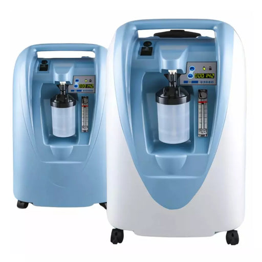 Two portable oxygen concentrators shown on a plain white background, one smaller unit behind a larger unit. The machines are light blue and white with black wheels and a digital control display on the front.