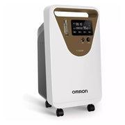 An Omron Y-506W portable oxygen concentrator on wheels, featuring a white and dark gray body with a gold-colored front panel and a digital display screen.