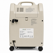 Back view of a beige Geymed portable oxygen concentrator with wheels, a top handle, and a white product label on a white background.
