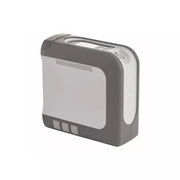 A compact gray and white electronic device, possibly a portable heater, humidifier, or air purifier, shown from a three-quarters angle on a plain white background.